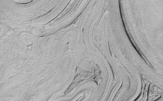 <h1>PIA04783:  Hellas Planitia</h1><div class="PIA04783" lang="en" style="width:799px;text-align:left;margin:auto;background-color:#000;padding:10px;max-height:150px;overflow:auto;">MGS MOC Release No. MOC2-505, 6 October 2003<p />Northwest Hellas Planitia presents an array of strange-looking surfaces. This Mars Global Surveyor (MGS) Mars Orbiter Camera (MOC) picture shows an example near 39.3°S, 306.7°W. The scene is illuminated by sunlight from the upper left. Some of the banding apparent in this image may be related to layering, but the overall cause for the patterns remains elusive. Hellas Basin is a difficult place to obtain MOC high resolution images, because for most of the year it is cloudy. The clouds clear up and imaging opportunities are spectacular in southern autumn, the time of year that this image was obtained. This picture covers an area 3 km (1.9 mi) wide.<br /><br /><a href="http://photojournal.jpl.nasa.gov/catalog/PIA04783" onclick="window.open(this.href); return false;" title="Voir l'image 	 PIA04783:  Hellas Planitia	  sur le site de la NASA">Voir l'image 	 PIA04783:  Hellas Planitia	  sur le site de la NASA.</a></div>
