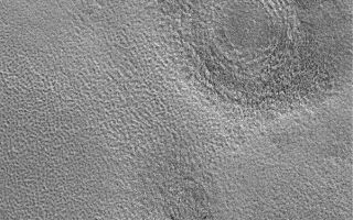 <h1>PIA05013:  Northern Plains Buried Craters</h1><div class="PIA05013" lang="en" style="width:601px;text-align:left;margin:auto;background-color:#000;padding:10px;max-height:150px;overflow:auto;">22 December 2003<p />This Mars Global Surveyor (MGS) Mars Orbiter Camera (MOC) image shows three circular features on the martian northern plains near 70.7°N, 311.7°W. These circular features are the locations of meteor impact craters that have been buried beneath the plains. Much of the northern plains shares this story, in which thousands of old craters have been filled or partially filled and then thinly buried beneath textured plains. The picture covers an area 3 km (1.9 mi) wide. Sunlight illuminates the scene from the lower left.<br /><br /><a href="http://photojournal.jpl.nasa.gov/catalog/PIA05013" onclick="window.open(this.href); return false;" title="Voir l'image 	 PIA05013:  Northern Plains Buried Craters	  sur le site de la NASA">Voir l'image 	 PIA05013:  Northern Plains Buried Craters	  sur le site de la NASA.</a></div>