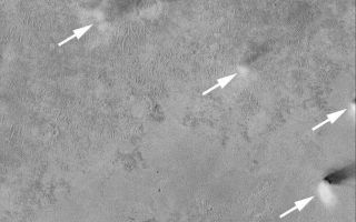 <h1>PIA05126:  Dust Devils Near Schiaparelli</h1><div class="PIA05126" lang="en" style="width:672px;text-align:left;margin:auto;background-color:#000;padding:10px;max-height:150px;overflow:auto;">9 January 2004 <br /> The four arrows in this Mars Global Surveyor (MGS) Mars Orbiter Camera (MOC) image point to active dust devils captured around 2 p.m. local time on a flat plain west of the large basin, Schiaparelli. This image is located near 5.1°S, 348.9°W; and covers an area 3 km (1.9 mi) wide. The dust devil shadows point toward the northeast (upper right) because sunlight illuminates the scene from the southwest (lower left).<br /><br /><a href="http://photojournal.jpl.nasa.gov/catalog/PIA05126" onclick="window.open(this.href); return false;" title="Voir l'image 	 PIA05126:  Dust Devils Near Schiaparelli	  sur le site de la NASA">Voir l'image 	 PIA05126:  Dust Devils Near Schiaparelli	  sur le site de la NASA.</a></div>