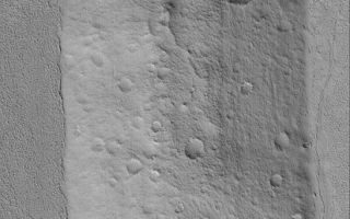 <h1>PIA05128:  Cratered Hill in Amazonis</h1><div class="PIA05128" lang="en" style="width:547px;text-align:left;margin:auto;background-color:#000;padding:10px;max-height:150px;overflow:auto;">11 January 2004 <br /> Looking somewhat like a martian moon that has been plunked down into a rough-textured but otherwise flat plain, this Mars Global Surveyor (MGS) Mars Orbiter Camera (MOC) image shows an old, cratered hill was once part of the rim of a meteor impact crater. The crater has been both eroded away and partly filled and buried beneath the rugged plains. The hill is interpreted to be considerably older than the plains, because it has considerably more small meteor craters than the surrounding terrain. This hill is located near 23.0°N, 166.5°W. The image covers an area 3 km (1.9 mi) wide and is illuminated by sunlight from the lower left.<br /><br /><a href="http://photojournal.jpl.nasa.gov/catalog/PIA05128" onclick="window.open(this.href); return false;" title="Voir l'image 	 PIA05128:  Cratered Hill in Amazonis	  sur le site de la NASA">Voir l'image 	 PIA05128:  Cratered Hill in Amazonis	  sur le site de la NASA.</a></div>