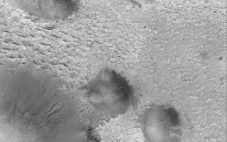 <h1>PIA05264:  Sedimentary Rocks of Aram Chaos</h1><div class="PIA05264" lang="en" style="width:800px;text-align:left;margin:auto;background-color:#000;padding:10px;max-height:150px;overflow:auto;">4 February 2004 <br /> Aram Chaos is a large meteor impact crater that was nearly filled with sediment. Over time, this sediment was hardened to form sedimentary rock. Today, much of the eastern half of the crater has exposures of light-toned sedimentary rock, such as the outcrops shown in this Mars Global Surveyor (MGS) Mars Orbiter Camera (MOC) image. The picture is located near 2.0°N, 20.3°W, and covers an area 3 km (1.9 mi) wide. Sunlight illuminates the scene from the left.<br /><br /><a href="http://photojournal.jpl.nasa.gov/catalog/PIA05264" onclick="window.open(this.href); return false;" title="Voir l'image 	 PIA05264:  Sedimentary Rocks of Aram Chaos	  sur le site de la NASA">Voir l'image 	 PIA05264:  Sedimentary Rocks of Aram Chaos	  sur le site de la NASA.</a></div>