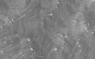 <h1>PIA05280:  Wind-Streaked Slopes</h1><div class="PIA05280" lang="en" style="width:800px;text-align:left;margin:auto;background-color:#000;padding:10px;max-height:150px;overflow:auto;">6 February 2004 <br /> This Mars Global Surveyor (MGS) Mars Orbiter Camera (MOC) image shows very heavily wind-streaked slopes in an area near southern Claritas Fossae. Wind rushing down slopes toward the lower left has moved fine sediment to create these patterns. This is located near 25.3°S, 109.7°W, and covers an area 3 km (1.9 mi) wide. Sunlight illuminates the scene from the lower left.<br /><br /><a href="http://photojournal.jpl.nasa.gov/catalog/PIA05280" onclick="window.open(this.href); return false;" title="Voir l'image 	 PIA05280:  Wind-Streaked Slopes	  sur le site de la NASA">Voir l'image 	 PIA05280:  Wind-Streaked Slopes	  sur le site de la NASA.</a></div>