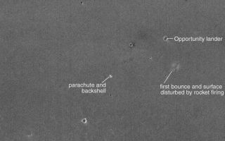<h1>PIA05299:  Third MOC View of Opportunity Landing Site</h1><div class="PIA05299" lang="en" style="width:799px;text-align:left;margin:auto;background-color:#000;padding:10px;max-height:150px;overflow:auto;">17 February 2004 <br /> Around 19:03 UTC on 15 February 2004, the Mars Global Surveyor (MGS) spacecraft flew almost directly over the Mars Exploration Rover (MER-B), Opportunity, landing site. The MGS Mars Orbiter Camera (MOC) team decided, therefore, to take MOC's third picture of the lander. Unlike the previous two images, this attempt did not require rolling the spacecraft to hit the target. The image shows the location of the lander in its small impact crater; it also shows the locations of the parachute/backshell and the area disturbed by landing rockets and the first bounce. The heat shield impact site was too far east for the camera to view. The Opportunity landing site is near 2.0°S, 5.6°W in Meridiani Planum. Sunlight illuminates the scene from the left. The 150 meter scale bar is about 164 yards long. The image is not map-projected; north is toward the top/upper right.<br /><br /><a href="http://photojournal.jpl.nasa.gov/catalog/PIA05299" onclick="window.open(this.href); return false;" title="Voir l'image 	 PIA05299:  Third MOC View of Opportunity Landing Site	  sur le site de la NASA">Voir l'image 	 PIA05299:  Third MOC View of Opportunity Landing Site	  sur le site de la NASA.</a></div>