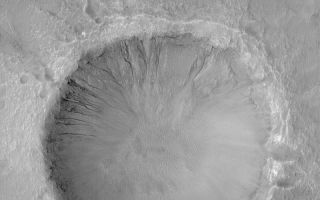 <h1>PIA05316:  Gullied Crater Wall</h1><div class="PIA05316" lang="en" style="width:800px;text-align:left;margin:auto;background-color:#000;padding:10px;max-height:150px;overflow:auto;">18 February 2004 <br /> Many craters and troughs at middle latitudes on Mars have gullies carved into their slopes. These gullies often have banked or even meandering channels that indicate a fluid with the properties of water may have been involved. Indeed, it is possible that such gullies indicate places where liquid water seeped out to the martian surface, or formed from melting ice, in the not-too-distant past. This Mars Global Surveyor (MGS) Mars Orbiter Camera (MOC) image shows an example located in a crater in Terra Cimmeria near 37.7°S, 191.6°W. The picture was acquired only a few months ago in November 2003. Sunlight illuminates the scene from the left/upper left; the picture covers an area 3 km (1.9 mi) wide.<br /><br /><a href="http://photojournal.jpl.nasa.gov/catalog/PIA05316" onclick="window.open(this.href); return false;" title="Voir l'image 	 PIA05316:  Gullied Crater Wall	  sur le site de la NASA">Voir l'image 	 PIA05316:  Gullied Crater Wall	  sur le site de la NASA.</a></div>