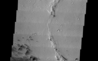 <h1>PIA05346:  Gusev Crater</h1><div class="PIA05346" lang="en" style="width:516px;text-align:left;margin:auto;background-color:#000;padding:10px;max-height:150px;overflow:auto;"><a href="/figures/PIA05346_context.jpg"></a><br /><p />Released 6 January 2004<p />Long before the MER landers were named or launched, the two orbiters at Mars were asked to examine landing sites. Both the Odyssey and Mars Global Surveyor spacecraft have been collecting landing site data for the past two years. The MGS and ODY data were used as part of the decision making process in the final selection of the two landing sites. The types of data collected by the two orbiters included not only images of the surface but also thermal data about the surface composition, atmospheric data about the climate at each location, and the tracking of major dust storms in the region prior to landing. The presence of, and data collected by, the MGS and ODY orbiters have proven invaluable in MER mission planning.<p />Image information: VIS instrument. Latitude -14.5, Longitude 175.8 East (184.2 West). 19 meter/pixel resolution.<p />Note: this THEMIS visual image has not been radiometrically nor geometrically calibrated for this preliminary release. An empirical correction has been performed to remove instrumental effects. A linear shift has been applied in the cross-track and down-track direction to approximate spacecraft and planetary motion. Fully calibrated and geometrically projected images will be released through the Planetary Data System in accordance with Project policies at a later time.<p />NASA's Jet Propulsion Laboratory manages the 2001 Mars Odyssey mission for NASA's Office of Space Science, Washington, D.C. The Thermal Emission Imaging System (THEMIS) was developed by Arizona State University, Tempe, in collaboration with Raytheon Santa Barbara Remote Sensing. The THEMIS investigation is led by Dr. Philip Christensen at Arizona State University. Lockheed Martin Astronautics, Denver, is the prime contractor for the Odyssey project, and developed and built the orbiter. Mission operations are conducted jointly from Lockheed Martin and from JPL, a division of the California Institute of Technology in Pasadena.<br /><br /><a href="http://photojournal.jpl.nasa.gov/catalog/PIA05346" onclick="window.open(this.href); return false;" title="Voir l'image 	 PIA05346:  Gusev Crater	  sur le site de la NASA">Voir l'image 	 PIA05346:  Gusev Crater	  sur le site de la NASA.</a></div>