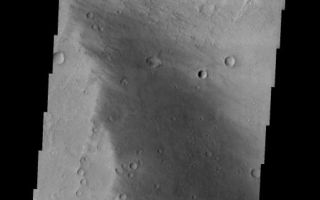 <h1>PIA05353:  Craters within Craters</h1><div class="PIA05353" lang="en" style="width:515px;text-align:left;margin:auto;background-color:#000;padding:10px;max-height:150px;overflow:auto;"><a href="/figures/PIA05353_context.jpg"></a><br /><p />Released 15 January 2004<p />Long before the MER landers were named or launched, the two orbiters at Mars were asked to examine landing sites. Both the Odyssey and Mars Global Surveyor spacecraft have been collecting landing site data for the past two years. The MGS and ODY data were used as part of the decision making process in the final selection of the two landing sites. The types of data collected by the two orbiters included not only images of the surface but also thermal data about the surface composition, atmospheric data about the climate at each location, and the tracking of major dust storms in the region prior to landing. The presence of, and data collected by, the MGS and ODY orbiters have proven invaluable in MER mission planning.<p />This image, taken on 25 April 2002, shows a smaller crater on the floor of the much larger Gusev Crater.<p />Image information: VIS instrument. Latitude -14.8, Longitude 174.7 East (185.3 West). 19 meter/pixel resolution.<p />Note: this THEMIS visual image has not been radiometrically nor geometrically calibrated for this preliminary release. An empirical correction has been performed to remove instrumental effects. A linear shift has been applied in the cross-track and down-track direction to approximate spacecraft and planetary motion. Fully calibrated and geometrically projected images will be released through the Planetary Data System in accordance with Project policies at a later time.<p />NASA's Jet Propulsion Laboratory manages the 2001 Mars Odyssey mission for NASA's Office of Space Science, Washington, D.C. The Thermal Emission Imaging System (THEMIS) was developed by Arizona State University, Tempe, in collaboration with Raytheon Santa Barbara Remote Sensing. The THEMIS investigation is led by Dr. Philip Christensen at Arizona State University. Lockheed Martin Astronautics, Denver, is the prime contractor for the Odyssey project, and developed and built the orbiter. Mission operations are conducted jointly from Lockheed Martin and from JPL, a division of the California Institute of Technology in Pasadena.<br /><br /><a href="http://photojournal.jpl.nasa.gov/catalog/PIA05353" onclick="window.open(this.href); return false;" title="Voir l'image 	 PIA05353:  Craters within Craters	  sur le site de la NASA">Voir l'image 	 PIA05353:  Craters within Craters	  sur le site de la NASA.</a></div>