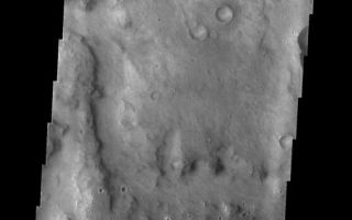 <h1>PIA05356:  Meridiani Planum</h1><div class="PIA05356" lang="en" style="width:521px;text-align:left;margin:auto;background-color:#000;padding:10px;max-height:150px;overflow:auto;"><a href="/figures/PIA05356_context.jpg"></a><br /><p />Released 20 January 2004<p />Long before the MER landers were named or launched, the two orbiters at Mars were asked to examine landing sites. Both the Odyssey and Mars Global Surveyor spacecraft have been collecting landing site data for the past two years. The MGS and ODY data were used as part of the decision making process in the final selection of the two landing sites. The types of data collected by the two orbiters included not only images of the surface but also thermal data about the surface composition, atmospheric data about the climate at each location, and the tracking of major dust storms in the region prior to landing. The presence of, and data collected by, the MGS and ODY orbiters have proven invaluable in MER mission planning.<p />This image, captured on 13 April 2003, shows an area to the west of Opportunity's projected landing spot on Meridiani Planum.<p />Image information: VIS instrument. Latitude -4.8, Longitude 355.8 East (4.2 West). 19 meter/pixel resolution.<p />Note: this THEMIS visual image has not been radiometrically nor geometrically calibrated for this preliminary release. An empirical correction has been performed to remove instrumental effects. A linear shift has been applied in the cross-track and down-track direction to approximate spacecraft and planetary motion. Fully calibrated and geometrically projected images will be released through the Planetary Data System in accordance with Project policies at a later time.<p />NASA's Jet Propulsion Laboratory manages the 2001 Mars Odyssey mission for NASA's Office of Space Science, Washington, D.C. The Thermal Emission Imaging System (THEMIS) was developed by Arizona State University, Tempe, in collaboration with Raytheon Santa Barbara Remote Sensing. The THEMIS investigation is led by Dr. Philip Christensen at Arizona State University. Lockheed Martin Astronautics, Denver, is the prime contractor for the Odyssey project, and developed and built the orbiter. Mission operations are conducted jointly from Lockheed Martin and from JPL, a division of the California Institute of Technology in Pasadena.<br /><br /><a href="http://photojournal.jpl.nasa.gov/catalog/PIA05356" onclick="window.open(this.href); return false;" title="Voir l'image 	 PIA05356:  Meridiani Planum	  sur le site de la NASA">Voir l'image 	 PIA05356:  Meridiani Planum	  sur le site de la NASA.</a></div>