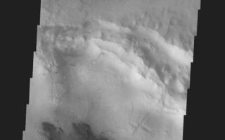 <h1>PIA05357:  West Meridiani Crater</h1><div class="PIA05357" lang="en" style="width:524px;text-align:left;margin:auto;background-color:#000;padding:10px;max-height:150px;overflow:auto;"><a href="/figures/PIA05357_context.jpg"></a><br /><p />Released 21 January 2004<p />Long before the MER landers were named or launched, the two orbiters at Mars were asked to examine landing sites. Both the Odyssey and Mars Global Surveyor spacecraft have been collecting landing site data for the past two years. The MGS and ODY data were used as part of the decision making process in the final selection of the two landing sites. The types of data collected by the two orbiters included not only images of the surface but also thermal data about the surface composition, atmospheric data about the climate at each location, and the tracking of major dust storms in the region prior to landing. The presence of, and data collected by, the MGS and ODY orbiters have proven invaluable in MER mission planning.<p />This image was captured on 23 August 2003, while the Opportunity rover was already on its way to Mars. This image is to the west of Opportunity's projected landing spot.<p />Image information: VIS instrument. Latitude -2.1, Longitude 351.7 East (8.3 West). 19 meter/pixel resolution.<p />Note: this THEMIS visual image has not been radiometrically nor geometrically calibrated for this preliminary release. An empirical correction has been performed to remove instrumental effects. A linear shift has been applied in the cross-track and down-track direction to approximate spacecraft and planetary motion. Fully calibrated and geometrically projected images will be released through the Planetary Data System in accordance with Project policies at a later time.<p />NASA's Jet Propulsion Laboratory manages the 2001 Mars Odyssey mission for NASA's Office of Space Science, Washington, D.C. The Thermal Emission Imaging System (THEMIS) was developed by Arizona State University, Tempe, in collaboration with Raytheon Santa Barbara Remote Sensing. The THEMIS investigation is led by Dr. Philip Christensen at Arizona State University. Lockheed Martin Astronautics, Denver, is the prime contractor for the Odyssey project, and developed and built the orbiter. Mission operations are conducted jointly from Lockheed Martin and from JPL, a division of the California Institute of Technology in Pasadena.<br /><br /><a href="http://photojournal.jpl.nasa.gov/catalog/PIA05357" onclick="window.open(this.href); return false;" title="Voir l'image 	 PIA05357:  West Meridiani Crater	  sur le site de la NASA">Voir l'image 	 PIA05357:  West Meridiani Crater	  sur le site de la NASA.</a></div>