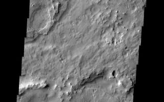 <h1>PIA05363:  Northwest Meridiani</h1><div class="PIA05363" lang="en" style="width:525px;text-align:left;margin:auto;background-color:#000;padding:10px;max-height:150px;overflow:auto;"><a href="/figures/PIA05363_context.jpg"></a><br /><p />Released 29 January 2004<p />Long before the MER landers were named or launched, the two orbiters at Mars were asked to examine landing sites. Both the Odyssey and Mars Global Surveyor spacecraft have been collecting landing site data for the past two years. The MGS and ODY data were used as part of the decision making process in the final selection of the two landing sites. The types of data collected by the two orbiters included not only images of the surface but also thermal data about the surface composition, atmospheric data about the climate at each location, and the tracking of major dust storms in the region prior to landing. The presence of, and data collected by, the MGS and ODY orbiters have proven invaluable in MER mission planning.<p />This image, captured on 13 December 2002, covers an area to the north of Opportunity's landing spot in Meridiani Planum.<p />Image information: VIS instrument. Latitude 1.7, Longitude 355.7 East (4.3 West). 19 meter/pixel resolution.<p />Note: this THEMIS visual image has not been radiometrically nor geometrically calibrated for this preliminary release. An empirical correction has been performed to remove instrumental effects. A linear shift has been applied in the cross-track and down-track direction to approximate spacecraft and planetary motion. Fully calibrated and geometrically projected images will be released through the Planetary Data System in accordance with Project policies at a later time.<p />NASA's Jet Propulsion Laboratory manages the 2001 Mars Odyssey mission for NASA's Office of Space Science, Washington, D.C. The Thermal Emission Imaging System (THEMIS) was developed by Arizona State University, Tempe, in collaboration with Raytheon Santa Barbara Remote Sensing. The THEMIS investigation is led by Dr. Philip Christensen at Arizona State University. Lockheed Martin Astronautics, Denver, is the prime contractor for the Odyssey project, and developed and built the orbiter. Mission operations are conducted jointly from Lockheed Martin and from JPL, a division of the California Institute of Technology in Pasadena.<br /><br /><a href="http://photojournal.jpl.nasa.gov/catalog/PIA05363" onclick="window.open(this.href); return false;" title="Voir l'image 	 PIA05363:  Northwest Meridiani	  sur le site de la NASA">Voir l'image 	 PIA05363:  Northwest Meridiani	  sur le site de la NASA.</a></div>