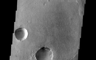 <h1>PIA05364:  Craters within Craters in Meridiani</h1><div class="PIA05364" lang="en" style="width:526px;text-align:left;margin:auto;background-color:#000;padding:10px;max-height:150px;overflow:auto;"><a href="/figures/PIA05364_context.jpg"></a><br /><p />Released 30 January 2004<p />Long before the MER landers were named or launched, the two orbiters at Mars were asked to examine landing sites. Both the Odyssey and Mars Global Surveyor spacecraft have been collecting landing site data for the past two years. The MGS and ODY data were used as part of the decision making process in the final selection of the two landing sites. The types of data collected by the two orbiters included not only images of the surface but also thermal data about the surface composition, atmospheric data about the climate at each location, and the tracking of major dust storms in the region prior to landing. The presence of, and data collected by, the MGS and ODY orbiters have proven invaluable in MER mission planning.<p />This image, captured on 13 December 2002, covers an area to the north of Opportunity's landing spot in Meridiani Planum.<p />Image information: VIS instrument. Latitude 2.5, Longitude 355.1 East (4.9 West). 19 meter/pixel resolution.<p />Note: this THEMIS visual image has not been radiometrically nor geometrically calibrated for this preliminary release. An empirical correction has been performed to remove instrumental effects. A linear shift has been applied in the cross-track and down-track direction to approximate spacecraft and planetary motion. Fully calibrated and geometrically projected images will be released through the Planetary Data System in accordance with Project policies at a later time.<p />NASA's Jet Propulsion Laboratory manages the 2001 Mars Odyssey mission for NASA's Office of Space Science, Washington, D.C. The Thermal Emission Imaging System (THEMIS) was developed by Arizona State University, Tempe, in collaboration with Raytheon Santa Barbara Remote Sensing. The THEMIS investigation is led by Dr. Philip Christensen at Arizona State University. Lockheed Martin Astronautics, Denver, is the prime contractor for the Odyssey project, and developed and built the orbiter. Mission operations are conducted jointly from Lockheed Martin and from JPL, a division of the California Institute of Technology in Pasadena.<br /><br /><a href="http://photojournal.jpl.nasa.gov/catalog/PIA05364" onclick="window.open(this.href); return false;" title="Voir l'image 	 PIA05364:  Craters within Craters in Meridiani	  sur le site de la NASA">Voir l'image 	 PIA05364:  Craters within Craters in Meridiani	  sur le site de la NASA.</a></div>