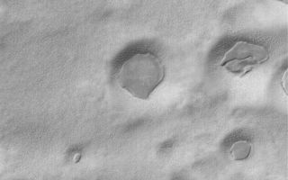 <h1>PIA05443:  South Polar Layer Remnants</h1><div class="PIA05443" lang="en" style="width:800px;text-align:left;margin:auto;background-color:#000;padding:10px;max-height:150px;overflow:auto;">24 February 2004 <br /> The thin, dark, angular mesas in depressions in this Mars Global Surveyor (MGS) Mars Orbiter Camera (MOC) image are remnants of a layer of material that has been largely stripped away from the region. The picture is located in the south polar region near 78.1°S, 272.2°W. Sunlight illuminates the scene from the upper left; the picture covers an area 3 km (1.9 mi) wide.<br /><br /><a href="http://photojournal.jpl.nasa.gov/catalog/PIA05443" onclick="window.open(this.href); return false;" title="Voir l'image 	 PIA05443:  South Polar Layer Remnants	  sur le site de la NASA">Voir l'image 	 PIA05443:  South Polar Layer Remnants	  sur le site de la NASA.</a></div>