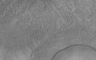 <h1>PIA05447:  Middle-Latitude Craters</h1><div class="PIA05447" lang="en" style="width:653px;text-align:left;margin:auto;background-color:#000;padding:10px;max-height:150px;overflow:auto;">26 February 2004 <br /> This Mars Global Surveyor (MGS) Mars Orbiter Camera (MOC) image shows two craters and a rough-textured surface in Icaria Planum near 44.5°S, 109.8°W. Both craters have been buried by a thin mantle of material that eroded to form a rough texture. The ejecta pattern from the smaller of the two craters is still apparent through this mantle. While this is a southern mid-latitude surface, similar textures and thinly-buried craters are common at northern mid-latitudes, as well. Sunlight illuminates the scene from the upper left; the picture covers an area 3 km (1.9 mi) wide.<br /><br /><a href="http://photojournal.jpl.nasa.gov/catalog/PIA05447" onclick="window.open(this.href); return false;" title="Voir l'image 	 PIA05447:  Middle-Latitude Craters	  sur le site de la NASA">Voir l'image 	 PIA05447:  Middle-Latitude Craters	  sur le site de la NASA.</a></div>