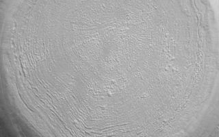 <h1>PIA05526:  West Elysium Planitia Crater</h1><div class="PIA05526" lang="en" style="width:424px;text-align:left;margin:auto;background-color:#000;padding:10px;max-height:150px;overflow:auto;">28 February 2004 <br />This Mars Global Surveyor (MGS) Mars Orbiter Camera (MOC) image shows a middle northern latitude crater in western Elysium Planitia near 33.7°N, 257.8°W. The textured floor is a common feature at north and south middle latitudes, but its origin is not well understood. It is possible that sublimation of ice is a contributor to forming this texture, but it is just as possible that the processes do not involve ice or water in any form. Sunlight illuminates the scene from the lower left; the picture covers an area 3 km (1.9 mi) wide.<br /><br /><a href="http://photojournal.jpl.nasa.gov/catalog/PIA05526" onclick="window.open(this.href); return false;" title="Voir l'image 	 PIA05526:  West Elysium Planitia Crater	  sur le site de la NASA">Voir l'image 	 PIA05526:  West Elysium Planitia Crater	  sur le site de la NASA.</a></div>