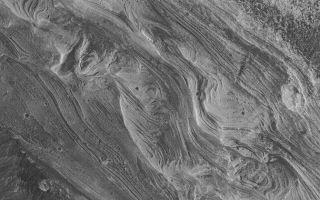<h1>PIA05533:  West Candor Layers</h1><div class="PIA05533" lang="en" style="width:672px;text-align:left;margin:auto;background-color:#000;padding:10px;max-height:150px;overflow:auto;">7 March 2004 <br />West Candor Chasma, one of the wide troughs of the great Valles Marineris canyon system, exhibits some of the most spectacular, varied, and extensive layered rock outcrops on Mars. This Mars Global Surveyor (MGS) Mars Orbiter Camera (MOC) image shows some of the layers of sedimentary rock exposed in west Candor Chasma near 5.9°S, 75.6°W. The picture covers an area approximately 3 km (1.9 mi) wide; sunlight illuminates the scene from the left/lower left.<br /><br /><a href="http://photojournal.jpl.nasa.gov/catalog/PIA05533" onclick="window.open(this.href); return false;" title="Voir l'image 	 PIA05533:  West Candor Layers	  sur le site de la NASA">Voir l'image 	 PIA05533:  West Candor Layers	  sur le site de la NASA.</a></div>