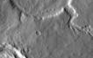 <h1>PIA05614:  Young Channel, Old Crater</h1><div class="PIA05614" lang="en" style="width:106px;text-align:left;margin:auto;background-color:#000;padding:10px;max-height:150px;overflow:auto;"><a href="/figures/PIA05614_fig1.jpg"> </a><br /><p />Released 18 March 2004<p />The Odyssey spacecraft has completed a full Mars year of observations of the red planet. For the next several weeks the Image of the Day will look back over this first mars year. It will focus on four themes: 1) the poles - with the seasonal changes seen in the retreat and expansion of the caps; 2) craters - with a variety of morphologies relating to impact materials and later alteration, both infilling and exhumation; 3) channels - the clues to liquid surface flow; and 4) volcanic flow features. While some images have helped answer questions about the history of Mars, many have raised new questions that are still being investigated as Odyssey continues collecting data as it orbits Mars.<p />Infrared images taken during the daytime exhibit both the morphological and thermophysical properties of the surface of Mars. Morphologic details are visible due to the effect of sun-facing slopes receiving more energy than antisun-facing slopes. This creates a warm (bright) slope and cool (dark) slope appearance that mimics the light and shadows of a visible wavelength image. Thermophysical properties are seen in that dust heats up more quickly than rocks. Thus dusty areas are bright and rocky areas are dark.<p />This daytime IR image was collected on February 3, 2003 during the northern summer season. This image shows a younger channel cutting through an older crater.<p />Image information: IR instrument. Latitude 30.8, Longitude 19 East (341 West). 19 meter/pixel resolution.<p />Note: this THEMIS visual image has not been radiometrically nor geometrically calibrated for this preliminary release. An empirical correction has been performed to remove instrumental effects. A linear shift has been applied in the cross-track and down-track direction to approximate spacecraft and planetary motion. Fully calibrated and geometrically projected images will be released through the Planetary Data System in accordance with Project policies at a later time. <p />NASA's Jet Propulsion Laboratory manages the 2001 Mars Odyssey mission for NASA's Office of Space Science, Washington, D.C. The Thermal Emission Imaging System (THEMIS) was developed by Arizona State University, Tempe, in collaboration with Raytheon Santa Barbara Remote Sensing. The THEMIS investigation is led by Dr. Philip Christensen at Arizona State University. Lockheed Martin Astronautics, Denver, is the prime contractor for the Odyssey project, and developed and built the orbiter. Mission operations are conducted jointly from Lockheed Martin and from JPL, a division of the California Institute of Technology in Pasadena.<br /><br /><a href="http://photojournal.jpl.nasa.gov/catalog/PIA05614" onclick="window.open(this.href); return false;" title="Voir l'image 	 PIA05614:  Young Channel, Old Crater	  sur le site de la NASA">Voir l'image 	 PIA05614:  Young Channel, Old Crater	  sur le site de la NASA.</a></div>