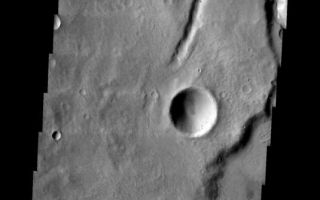 <h1>PIA05665:  Tinia Vallis Channel</h1><div class="PIA05665" lang="en" style="width:535px;text-align:left;margin:auto;background-color:#000;padding:10px;max-height:150px;overflow:auto;"><a href="/figures/PIA05665_fig1.jpg"> </a><br /><p />Released 31 March 2004<p />The Odyssey spacecraft has completed a full Mars year of observations of the red planet. For the next several weeks the Image of the Day will look back over this first mars year. It will focus on four themes: 1) the poles - with the seasonal changes seen in the retreat and expansion of the caps; 2) craters - with a variety of morphologies relating to impact materials and later alteration, both infilling and exhumation; 3) channels - the clues to liquid surface flow; and 4) volcanic flow features. While some images have helped answer questions about the history of Mars, many have raised new questions that are still being investigated as Odyssey continues collecting data as it orbits Mars.<p />The channel shown on the image is part of the Tinia Vallis region. It was collected July 11, 2002 during southern autumn season. The local time is 4pm. The image shows a small channel with a delta.<p />Image information: VIS instrument. Latitude -4.8, Longitude 211 East (149 West). 19 meter/pixel resolution.<p />Note: this THEMIS visual image has not been radiometrically nor geometrically calibrated for this preliminary release. An empirical correction has been performed to remove instrumental effects. A linear shift has been applied in the cross-track and down-track direction to approximate spacecraft and planetary motion. Fully calibrated and geometrically projected images will be released through the Planetary Data System in accordance with Project policies at a later time.<p />NASA's Jet Propulsion Laboratory manages the 2001 Mars Odyssey mission for NASA's Office of Space Science, Washington, D.C. The Thermal Emission Imaging System (THEMIS) was developed by Arizona State University, Tempe, in collaboration with Raytheon Santa Barbara Remote Sensing. The THEMIS investigation is led by Dr. Philip Christensen at Arizona State University. Lockheed Martin Astronautics, Denver, is the prime contractor for the Odyssey project, and developed and built the orbiter. Mission operations are conducted jointly from Lockheed Martin and from JPL, a division of the California Institute of Technology in Pasadena.<br /><br /><a href="http://photojournal.jpl.nasa.gov/catalog/PIA05665" onclick="window.open(this.href); return false;" title="Voir l'image 	 PIA05665:  Tinia Vallis Channel	  sur le site de la NASA">Voir l'image 	 PIA05665:  Tinia Vallis Channel	  sur le site de la NASA.</a></div>