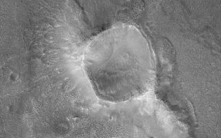 <h1>PIA05704:  Crater in Cydonia</h1><div class="PIA05704" lang="en" style="width:672px;text-align:left;margin:auto;background-color:#000;padding:10px;max-height:150px;overflow:auto;">30 March 2004<br />Erosion has created a wide variety of landforms in the Cydonia region of Mars. Located in a zone of transition from cratered highlands to northern plains, Cydonia is a jumble of thousands of massifs, mesas, buttes, and hills---remnants of ancient cratered highlands in a state of advanced erosion. This Mars Global Surveyor (MGS) Mars Orbiter Camera (MOC) image shows a crater, slightly smaller than the famous 1 kilometer-diameter (0.62 miles) Meteor Crater in Arizona, U.S.A., that has been left standing high relative to the surrounding terrain because erosion removed most of the rock into which this crater originally formed. Later processes have mantled the crater and surroundings with debris that, at a finer scale, has also been eroded over time. This image occurs near 40.1°N, 13.6°W, and covers an area about 3 km (1.9 mi) across. Sunlight illuminates the scene from the lower left.<br /><br /><a href="http://photojournal.jpl.nasa.gov/catalog/PIA05704" onclick="window.open(this.href); return false;" title="Voir l'image 	 PIA05704:  Crater in Cydonia	  sur le site de la NASA">Voir l'image 	 PIA05704:  Crater in Cydonia	  sur le site de la NASA.</a></div>