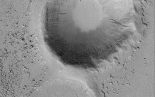 <h1>PIA05739:  Marte Valles Crater "Island"</h1><div class="PIA05739" lang="en" style="width:572px;text-align:left;margin:auto;background-color:#000;padding:10px;max-height:150px;overflow:auto;"><p>10 April 2004<br />Marte Valles is an outflow channel system that straddles 180°W longitude between the region south of Cerberus and far northwestern Amazonis. The floor of the Marte valleys have enigmatic platy flow features that some argue are formed by lava, others suggest they are remnants of mud flows. This Mars Global Surveyor (MGS) Mars Orbiter Camera (MOC) image shows an island created in the middle of the main Marte Valles channel as fluid---whether lava or mud---flowed past two older meteor impact craters. The craters are located near 21.5°N, 175.3°W. The image covers an area about 3 km (1.9 mi) across. Sunlight illuminates the scene from the lower left.</p><br /><br /><a href="http://photojournal.jpl.nasa.gov/catalog/PIA05739" onclick="window.open(this.href); return false;" title="Voir l'image 	 PIA05739:  Marte Valles Crater "Island"	  sur le site de la NASA">Voir l'image 	 PIA05739:  Marte Valles Crater "Island"	  sur le site de la NASA.</a></div>