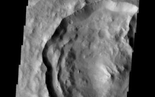 <h1>PIA05800:  MSIP: Multinational Research in Memnonia Fossae</h1><div class="PIA05800" lang="en" style="width:517px;text-align:left;margin:auto;background-color:#000;padding:10px;max-height:150px;overflow:auto;"><a href="/figures/PIA05800_fig1.jpg"> </a><br /><p>Released 21 April 2004</p><p>Our group is from Saratoga Springs, NY and is called the Saratoga Springs NASA Club. It contains approximately 30 students between 9th and 12th grade who have been participating since September of 2001. We also worked with a small group of students from Chekhov, Russia in order to do a joint MSIP project. Chekhov is the sister city of Saratoga Springs. Their group contains kids of the same age group as our NASA Club. Our group, along with a few students from the Chekhov branch, visited Arizona State University in November of 2003.</p><p>We targeted our image in the Memnonia Fossae Region because our thesis had to do with the relationship between craters with lobates and the depth of the craters as use for evidence of the presence of water in the past. Our Russian counter parts agreed with this idea because they wanted to look into the relationship between gully formation and whether or not it could hint at the presence of water on Mars.</p><p>The major feature of our image is a large crater that contains lobates situated on the mid-left hand side of the image. Other features present in the image include a graben running along the top section and a channel that runs parallel to it. We are still looking into the possibilities behind the structure of the crater and if it could have had something to do with the presence of water on the surface. This area is somewhat unique due to its relative closeness to a region containing three of the largest volcanoes in the solar system. We believe that the graben could be due to volcanic activity in the past that affected our area.</p><p>Image information: VIS instrument. Latitude -2.7, Longitude 217.2 East (142.8 West). 19 meter/pixel resolution.</p><p>NASA and Arizona State Universitys Mars Education Program is offering students nationwide the opportunity to be involved in authentic Mars research by participating in the Mars Student Imaging Project (MSIP). Teams of students in grades 5 through college sophomore level have the opportunity to work with scientists, mission planners and educators on the THEMIS team at ASUs Mars Space Flight Facility, to image a site on Mars using the THEMIS visible wavelength camera.  For more information go to the MSIP website: <a href="http://msip.asu.edu">http://msip.asu.edu</a>.</p><p>Note: this THEMIS visual image has not been radiometrically nor geometrically calibrated for this preliminary release. An empirical correction has been performed to remove instrumental effects. A linear shift has been applied in the cross-track and down-track direction to approximate spacecraft and planetary motion. Fully calibrated and geometrically projected images will be released through the Planetary Data System in accordance with Project policies at a later time.</p><p>NASA's Jet Propulsion Laboratory manages the 2001 Mars Odyssey mission for NASA's Office of Space Science, Washington, D.C. The Thermal Emission Imaging System (THEMIS) was developed by Arizona State University, Tempe, in collaboration with Raytheon Santa Barbara Remote Sensing. The THEMIS investigation is led by Dr. Philip Christensen at Arizona State University. Lockheed Martin Astronautics, Denver, is the prime contractor for the Odyssey project, and developed and built the orbiter. Mission operations are conducted jointly from Lockheed Martin and from JPL, a division of the California Institute of Technology in Pasadena.</p><br /><br /><a href="http://photojournal.jpl.nasa.gov/catalog/PIA05800" onclick="window.open(this.href); return false;" title="Voir l'image 	 PIA05800:  MSIP: Multinational Research in Memnonia Fossae	  sur le site de la NASA">Voir l'image 	 PIA05800:  MSIP: Multinational Research in Memnonia Fossae	  sur le site de la NASA.</a></div>