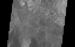 <h1>PIA05955:  Hebes Chasma</h1><div class="PIA05955" lang="en" style="width:534px;text-align:left;margin:auto;background-color:#000;padding:10px;max-height:150px;overflow:auto;"><a href="/figures/PIA05955_fig1.jpg"> </a><br /><p>The Odyssey spacecraft has taken some great pictures of Valles Marineris, the largest canyon in the solar system. If this canyon were on Earth, it would stretch from New York to Los Angeles. For the next several weeks, the Image of the Day will tour some of the canyons that make up this vast system. We will start with Ius Chasma in the west, and end with Coprates Chasma to the east. For more information on Vallis Marineris, please see <a href="http://mars.jpl.nasa.gov/mep/science/vm.html">http://mars.jpl.nasa.gov/mep/science/vm.html</a>.</p><p>This image shows part of Hebes Chasma. Sun shadows can be seen on the northern part of the image. There are dunes, flow-like features, and layered rocks present.</p>Image information: VIS instrument. Latitude -1.2, Longitude 282.3 East (77.7 West). 19 meter/pixel resolution.</p><p>Note: this THEMIS visual image has not been radiometrically nor geometrically calibrated for this preliminary release. An empirical correction has been performed to remove instrumental effects. A linear shift has been applied in the cross-track and down-track direction to approximate spacecraft and planetary motion. Fully calibrated and geometrically projected images will be released through the Planetary Data System in accordance with Project policies at a later time.</p><p>NASA's Jet Propulsion Laboratory manages the 2001 Mars Odyssey mission for NASA's Office of Space Science, Washington, D.C. The Thermal Emission Imaging System (THEMIS) was developed by Arizona State University, Tempe, in collaboration with Raytheon Santa Barbara Remote Sensing. The THEMIS investigation is led by Dr. Philip Christensen at Arizona State University. Lockheed Martin Astronautics, Denver, is the prime contractor for the Odyssey project, and developed and built the orbiter. Mission operations are conducted jointly from Lockheed Martin and from JPL, a division of the California Institute of Technology in Pasadena.</p><br /><br /><a href="http://photojournal.jpl.nasa.gov/catalog/PIA05955" onclick="window.open(this.href); return false;" title="Voir l'image 	 PIA05955:  Hebes Chasma	  sur le site de la NASA">Voir l'image 	 PIA05955:  Hebes Chasma	  sur le site de la NASA.</a></div>