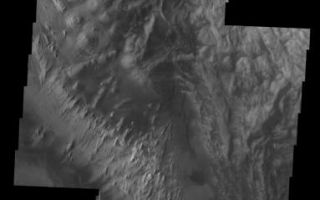 <h1>PIA05957:  Hebes Chasma Mosaic</h1><div class="PIA05957" lang="en" style="width:383px;text-align:left;margin:auto;background-color:#000;padding:10px;max-height:150px;overflow:auto;"><a href="/figures/PIA05957_fig1.jpg"> </a><br /><p>The Odyssey spacecraft has taken some great pictures of Valles Marineris, the largest canyon in the solar system. If this canyon were on Earth, it would stretch from New York to Los Angeles. For the next several weeks, the Image of the Day will tour some of the canyons that make up this vast system. We will start with Ius Chasma in the west, and end with Coprates Chasma to the east. For more information on Vallis Marineris, please see <a href="http://mars.jpl.nasa.gov/mep/science/vm.html">http://mars.jpl.nasa.gov/mep/science/vm.html</a>.</p><p>This image mosaic shows another part of Hebes Chasma. Sun shadows can be seen on the northern part of the image. There are dunes, flow like features, and layered rocks present.</p>Image information: VIS instrument. Latitude -1, Longitude 284.8 East (75.2 West). 19 meter/pixel resolution.</p><p>Note: this THEMIS visual image has not been radiometrically nor geometrically calibrated for this preliminary release. An empirical correction has been performed to remove instrumental effects. A linear shift has been applied in the cross-track and down-track direction to approximate spacecraft and planetary motion. Fully calibrated and geometrically projected images will be released through the Planetary Data System in accordance with Project policies at a later time.</p><p>NASA's Jet Propulsion Laboratory manages the 2001 Mars Odyssey mission for NASA's Office of Space Science, Washington, D.C. The Thermal Emission Imaging System (THEMIS) was developed by Arizona State University, Tempe, in collaboration with Raytheon Santa Barbara Remote Sensing. The THEMIS investigation is led by Dr. Philip Christensen at Arizona State University. Lockheed Martin Astronautics, Denver, is the prime contractor for the Odyssey project, and developed and built the orbiter. Mission operations are conducted jointly from Lockheed Martin and from JPL, a division of the California Institute of Technology in Pasadena.</p><br /><br /><a href="http://photojournal.jpl.nasa.gov/catalog/PIA05957" onclick="window.open(this.href); return false;" title="Voir l'image 	 PIA05957:  Hebes Chasma Mosaic	  sur le site de la NASA">Voir l'image 	 PIA05957:  Hebes Chasma Mosaic	  sur le site de la NASA.</a></div>