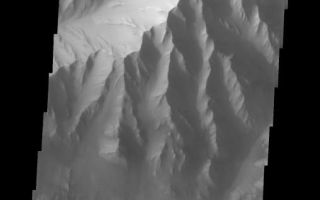 <h1>PIA05958:  Candor Chasma Rim</h1><div class="PIA05958" lang="en" style="width:508px;text-align:left;margin:auto;background-color:#000;padding:10px;max-height:150px;overflow:auto;"><a href="/figures/PIA05958_fig1.jpg"> </a><br /><p>The Odyssey spacecraft has taken some great pictures of Valles Marineris, the largest canyon in the solar system. If this canyon were on Earth, it would stretch from New York to Los Angeles. For the next several weeks, the Image of the Day will tour some of the canyons that make up this vast system. We will start with Ius Chasma in the west, and end with Coprates Chasma to the east. For more information on Vallis Marineris, please see <a href="http://mars.jpl.nasa.gov/mep/science/vm.html">http://mars.jpl.nasa.gov/mep/science/vm.html</a>.</p><p>This image shows the northern rim of Candor Chasma. Dunes and wind-shaped surfaces are very common in this area.</p>Image information: VIS instrument. Latitude -4.7, Longitude 284.3 East (75.7 West). 19 meter/pixel resolution.</p><p>Note: this THEMIS visual image has not been radiometrically nor geometrically calibrated for this preliminary release. An empirical correction has been performed to remove instrumental effects. A linear shift has been applied in the cross-track and down-track direction to approximate spacecraft and planetary motion. Fully calibrated and geometrically projected images will be released through the Planetary Data System in accordance with Project policies at a later time.</p><p>NASA's Jet Propulsion Laboratory manages the 2001 Mars Odyssey mission for NASA's Office of Space Science, Washington, D.C. The Thermal Emission Imaging System (THEMIS) was developed by Arizona State University, Tempe, in collaboration with Raytheon Santa Barbara Remote Sensing. The THEMIS investigation is led by Dr. Philip Christensen at Arizona State University. Lockheed Martin Astronautics, Denver, is the prime contractor for the Odyssey project, and developed and built the orbiter. Mission operations are conducted jointly from Lockheed Martin and from JPL, a division of the California Institute of Technology in Pasadena.</p><br /><br /><a href="http://photojournal.jpl.nasa.gov/catalog/PIA05958" onclick="window.open(this.href); return false;" title="Voir l'image 	 PIA05958:  Candor Chasma Rim	  sur le site de la NASA">Voir l'image 	 PIA05958:  Candor Chasma Rim	  sur le site de la NASA.</a></div>