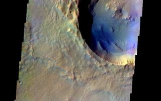 <h1>PIA05999:  Rampart Crater</h1><div class="PIA05999" lang="en" style="width:609px;text-align:left;margin:auto;background-color:#000;padding:10px;max-height:150px;overflow:auto;"><a href="/figures/PIA05999_fig1.jpg"> </a><br /><p>Released 20 May 2004</br>This image of a rampart crater was acquired Dec. 6, 2002, during northern summer.</p><p>The THEMIS VIS camera is capable of capturing color images of the martian surface using its five different color filters. In this mode of operation, the spatial resolution and coverage of the image must be reduced to accommodate the additional data volume produced from the use of multiple filters. To make a color image, three of the five filter images (each in grayscale) are selected. Each is contrast enhanced and then converted to a red, green, or blue intensity image. These three images are then combined to produce a full color, single image. Because the THEMIS color filters don't span the full range of colors seen by the human eye, a color THEMIS image does not represent true color. Also, because each single-filter image is contrast enhanced before inclusion in the three-color image, the apparent color variation of the scene is exaggerated. Nevertheless, the color variation that does appear is representative of some change in color, however subtle, in the actual scene. Note that the long edges of THEMIS color images typically contain color artifacts that do not represent surface variation.</p><p>Image information: VIS instrument. Latitude 28.4, Longitude 319.2 East (40.8 West). 38 meter/pixel resolution.</p><p>Note: this THEMIS visual image has not been radiometrically nor geometrically calibrated for this preliminary release. An empirical correction has been performed to remove instrumental effects. A linear shift has been applied in the cross-track and down-track direction to approximate spacecraft and planetary motion. Fully calibrated and geometrically projected images will be released through the Planetary Data System in accordance with Project policies at a later time.</p><p>NASA's Jet Propulsion Laboratory manages the 2001 Mars Odyssey mission for NASA's Office of Space Science, Washington, D.C. The Thermal Emission Imaging System (THEMIS) was developed by Arizona State University, Tempe, in collaboration with Raytheon Santa Barbara Remote Sensing. The THEMIS investigation is led by Dr. Philip Christensen at Arizona State University. Lockheed Martin Astronautics, Denver, is the prime contractor for the Odyssey project, and developed and built the orbiter. Mission operations are conducted jointly from Lockheed Martin and from JPL, a division of the California Institute of Technology in Pasadena.</p><br /><br /><a href="http://photojournal.jpl.nasa.gov/catalog/PIA05999" onclick="window.open(this.href); return false;" title="Voir l'image 	 PIA05999:  Rampart Crater	  sur le site de la NASA">Voir l'image 	 PIA05999:  Rampart Crater	  sur le site de la NASA.</a></div>