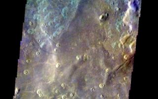 <h1>PIA06003:  Acidalia Planitia Crater</h1><div class="PIA06003" lang="en" style="width:612px;text-align:left;margin:auto;background-color:#000;padding:10px;max-height:150px;overflow:auto;"><a href="/figures/PIA06003_fig1.jpg"> </a><br /><p>Released 26 May 2004</br>This image of a crater in Acidalia Planitia was acquired March 8, 2003, during northern summer.</p><p>The THEMIS VIS camera is capable of capturing color images of the martian surface using its five different color filters. In this mode of operation, the spatial resolution and coverage of the image must be reduced to accommodate the additional data volume produced from the use of multiple filters. To make a color image, three of the five filter images (each in grayscale) are selected. Each is contrast enhanced and then converted to a red, green, or blue intensity image. These three images are then combined to produce a full color, single image. Because the THEMIS color filters don't span the full range of colors seen by the human eye, a color THEMIS image does not represent true color. Also, because each single-filter image is contrast enhanced before inclusion in the three-color image, the apparent color variation of the scene is exaggerated. Nevertheless, the color variation that does appear is representative of some change in color, however subtle, in the actual scene. Note that the long edges of THEMIS color images typically contain color artifacts that do not represent surface variation.</p><p>Image information: VIS instrument. Latitude 45.9, Longitude 6.1 East (353.9 West). 38 meter/pixel resolution.</p><p>Note: this THEMIS visual image has not been radiometrically nor geometrically calibrated for this preliminary release. An empirical correction has been performed to remove instrumental effects. A linear shift has been applied in the cross-track and down-track direction to approximate spacecraft and planetary motion. Fully calibrated and geometrically projected images will be released through the Planetary Data System in accordance with Project policies at a later time.</p><p>NASA's Jet Propulsion Laboratory manages the 2001 Mars Odyssey mission for NASA's Office of Space Science, Washington, D.C. The Thermal Emission Imaging System (THEMIS) was developed by Arizona State University, Tempe, in collaboration with Raytheon Santa Barbara Remote Sensing. The THEMIS investigation is led by Dr. Philip Christensen at Arizona State University. Lockheed Martin Astronautics, Denver, is the prime contractor for the Odyssey project, and developed and built the orbiter. Mission operations are conducted jointly from Lockheed Martin and from JPL, a division of the California Institute of Technology in Pasadena.</p><br /><br /><a href="http://photojournal.jpl.nasa.gov/catalog/PIA06003" onclick="window.open(this.href); return false;" title="Voir l'image 	 PIA06003:  Acidalia Planitia Crater	  sur le site de la NASA">Voir l'image 	 PIA06003:  Acidalia Planitia Crater	  sur le site de la NASA.</a></div>
