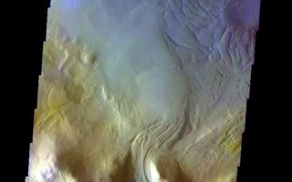 <h1>PIA06004:  Moreux Crater</h1><div class="PIA06004" lang="en" style="width:612px;text-align:left;margin:auto;background-color:#000;padding:10px;max-height:150px;overflow:auto;"><a href="/figures/PIA06004_fig1.jpg"> </a><br /><p>Released 27 May 2004</br>This image of material entering Moreux Crater from the rim area was acquired March 17, 2003, during northern summer.</p><p>The THEMIS VIS camera is capable of capturing color images of the martian surface using its five different color filters. In this mode of operation, the spatial resolution and coverage of the image must be reduced to accommodate the additional data volume produced from the use of multiple filters. To make a color image, three of the five filter images (each in grayscale) are selected. Each is contrast enhanced and then converted to a red, green, or blue intensity image. These three images are then combined to produce a full color, single image. Because the THEMIS color filters don't span the full range of colors seen by the human eye, a color THEMIS image does not represent true color. Also, because each single-filter image is contrast enhanced before inclusion in the three-color image, the apparent color variation of the scene is exaggerated. Nevertheless, the color variation that does appear is representative of some change in color, however subtle, in the actual scene. Note that the long edges of THEMIS color images typically contain color artifacts that do not represent surface variation.</p><p>Image information: VIS instrument. Latitude 41.1, Longitude 44.1 East (315.9 West). 38 meter/pixel resolution.</p><p>Note: this THEMIS visual image has not been radiometrically nor geometrically calibrated for this preliminary release. An empirical correction has been performed to remove instrumental effects. A linear shift has been applied in the cross-track and down-track direction to approximate spacecraft and planetary motion. Fully calibrated and geometrically projected images will be released through the Planetary Data System in accordance with Project policies at a later time.</p><p>NASA's Jet Propulsion Laboratory manages the 2001 Mars Odyssey mission for NASA's Office of Space Science, Washington, D.C. The Thermal Emission Imaging System (THEMIS) was developed by Arizona State University, Tempe, in collaboration with Raytheon Santa Barbara Remote Sensing. The THEMIS investigation is led by Dr. Philip Christensen at Arizona State University. Lockheed Martin Astronautics, Denver, is the prime contractor for the Odyssey project, and developed and built the orbiter. Mission operations are conducted jointly from Lockheed Martin and from JPL, a division of the California Institute of Technology in Pasadena.</p><br /><br /><a href="http://photojournal.jpl.nasa.gov/catalog/PIA06004" onclick="window.open(this.href); return false;" title="Voir l'image 	 PIA06004:  Moreux Crater	  sur le site de la NASA">Voir l'image 	 PIA06004:  Moreux Crater	  sur le site de la NASA.</a></div>
