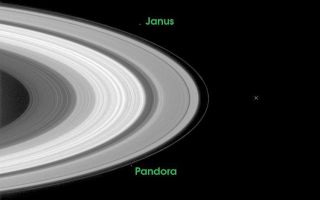 <h1>PIA06061:  Passage through the Ring Plane</h1><div class="PIA06061" lang="en" style="width:750px;text-align:left;margin:auto;background-color:#000;padding:10px;max-height:150px;overflow:auto;"><p>The path that lies ahead for the Cassini-Huygens mission is indicated in this image which illustrates where the spacecraft will be just 27 days from now, when it arrives at Saturn and crosses the ring plane 33 minutes before performing its critical orbital insertion maneuver.</p><p>The X indicates the point where Cassini will pierce the ring plane on June 30, 2004, going from south to north of the ring plane, 33 minutes before the main engine fires to begin orbital insertion. The indicated point is between the narrow F-ring on the left and Saturn's tenuous G-ring which is too faint to be seen in this exposure.</p><p>The image was taken on May 11, 2004 when the spacecraft was 26.3 million kilometers (16.3 million miles) from Saturn. Image scale is 158 kilometers (98 miles) per pixel. Moons visible in this image: Janus (181 kilometers or 113 miles across), one of the co-orbital moons; Pandora (84 kilometers or 52 miles across), one of the F ring shepherding moons; and Enceladus (499 kilometers or 310 miles across), a moon which may be heated from within and thus have a liquid sub-surface ocean.</p><p>The Cassini-Huygens mission is a cooperative project of NASA, the European Space Agency and the Italian Space Agency. The Jet Propulsion Laboratory, a division of the California Institute of Technology in Pasadena, manages the Cassini-Huygens mission for NASA's Office of Space Science, Washington, D.C. The Cassini orbiter and its two onboard cameras, were designed, developed and assembled at JPL. The imaging team is based at the Space Science Institute, Boulder, Colo.</p><p>For more information, about the Cassini-Huygens mission visit, <a href="http://saturn.jpl.nasa.gov/">http://saturn.jpl.nasa.gov</a> and the Cassini imaging team home page, <a href="http://ciclops.org/">http://ciclops.org</a>.</p><br /><br /><a href="http://photojournal.jpl.nasa.gov/catalog/PIA06061" onclick="window.open(this.href); return false;" title="Voir l'image 	 PIA06061:  Passage through the Ring Plane	  sur le site de la NASA">Voir l'image 	 PIA06061:  Passage through the Ring Plane	  sur le site de la NASA.</a></div>