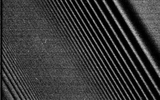 <h1>PIA06093:  Two Waves in One Spectacular Image of Saturn's Rings</h1><div class="PIA06093" lang="en" style="width:768px;text-align:left;margin:auto;background-color:#000;padding:10px;max-height:150px;overflow:auto;"><p>This image shows a bending wave (right) and density wave in Saturn's A ring, interior to the Encke Gap. It was taken by the narrow angle camera on the Cassini spacecraft after successful entry into Saturn's orbit. The view shows the dark, or unlit, side of the rings. </p><br /><br /><a href="http://photojournal.jpl.nasa.gov/catalog/PIA06093" onclick="window.open(this.href); return false;" title="Voir l'image 	 PIA06093:  Two Waves in One Spectacular Image of Saturn's Rings	  sur le site de la NASA">Voir l'image 	 PIA06093:  Two Waves in One Spectacular Image of Saturn's Rings	  sur le site de la NASA.</a></div>
