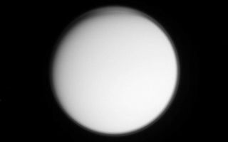 <h1>PIA06120:  High in the Titan Atmosphere</h1><div class="PIA06120" lang="en" style="width:800px;text-align:left;margin:auto;background-color:#000;padding:10px;max-height:150px;overflow:auto;"><p>High-altitude haze and perhaps cloud layers are visible in this imaging science subsystem image acquired on Oct. 24, 2004, as the Cassini spacecraft neared its first close encounter with Titan. The image was captured at a distance of about one million kilometers (620,000 miles) using a near-ultraviolet filter, which is sensitive to scattering by small particles. </p><p>The Sun preferentially illuminates the southern hemisphere at this time of year, and the northern day-night terminator is visible at the upper boundary. The well-known global detached haze layer, hundreds of kilometers or miles above Titan's surface, is visible as a thin bright ring around the entire planet. This layer is produced by photochemical reactions. </p><p>At the northern high-latitude edge of the image, additional striations are visible, caused by particulates that are at a high enough altitude to be illuminated by the Sun near the horizon despite the surface below being in darkness. These striations may simply be caused by wave perturbations propagating through the detached haze, or they may be evidence of additional regional haze or cloud layers not present at other latitudes.</p><p>The Cassini-Huygens mission is a cooperative project of NASA, the European Space Agency and the Italian Space Agency. The Jet Propulsion Laboratory, a division of the California Institute of Technology in Pasadena, manages the Cassini-Huygens mission for NASA's Office of Space Science, Washington, D.C. The Cassini orbiter and its two onboard cameras, were designed, developed and assembled at JPL. The imaging team is based at the Space Science Institute, Boulder, Colo.</p><p>For more information, about the Cassini-Huygens mission visit, <a href="http://saturn.jpl.nasa.gov/">http://saturn.jpl.nasa.gov</a> and the Cassini imaging team home page, <a href="http://ciclops.org/">http://ciclops.org</a>.</p><br /><br /><a href="http://photojournal.jpl.nasa.gov/catalog/PIA06120" onclick="window.open(this.href); return false;" title="Voir l'image 	 PIA06120:  High in the Titan Atmosphere	  sur le site de la NASA">Voir l'image 	 PIA06120:  High in the Titan Atmosphere	  sur le site de la NASA.</a></div>