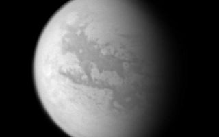 <h1>PIA06228:  Cassini's Views of Titan: Monochrome View</h1><div class="PIA06228" lang="en" style="width:757px;text-align:left;margin:auto;background-color:#000;padding:10px;max-height:150px;overflow:auto;"><p>This image composite was created with images taken during the Cassini spacecraft's closest flyby of Titan on April 16, 2005. Cassini's cameras have numerous filters that reveal features above and beneath the shroud of Titan's atmosphere.</p><p>This monochrome view shows what Titan looks like at 938 nanometers, a near-infrared wavelength that allows Cassini to see through the hazy atmosphere and down to the surface. The view was created by combining three separate images taken with this filter, in order to improve the visibility of surface features. The variations in brightness on the surface are real differences in the reflectivity of the materials on Titan.</p><p>North on Titan is up and tilted 30 degrees to the right.</p><p>These images were taken with the Cassini spacecraft wide angle camera on April 16, 2005, at distances ranging from approximately 173,000 to 168,200 kilometers (107,500 to 104,500 miles) from Titan and from a Sun-Titan-spacecraft, or phase, angle of 56 degrees. Resolution in the images is approximately 10 kilometers per pixel.</p><p>The Cassini-Huygens mission is a cooperative project of NASA, the European Space Agency and the Italian Space Agency. The Jet Propulsion Laboratory, a division of the California Institute of Technology in Pasadena, manages the mission for NASA's Science Mission Directorate, Washington, D.C. The Cassini orbiter and its two onboard cameras were designed, developed and assembled at JPL. The imaging team is based at the Space Science Institute, Boulder, Colo.</p><p>For more information about the Cassini-Huygens mission, visit <a href="http://saturn.jpl.nasa.gov">http://saturn.jpl.nasa.gov</a> and the Cassini imaging team home page, <a href="http://ciclops.org">http://ciclops.org</a>.</p>p><br /><br /><a href="http://photojournal.jpl.nasa.gov/catalog/PIA06228" onclick="window.open(this.href); return false;" title="Voir l'image 	 PIA06228:  Cassini's Views of Titan: Monochrome View	  sur le site de la NASA">Voir l'image 	 PIA06228:  Cassini's Views of Titan: Monochrome View	  sur le site de la NASA.</a></div>