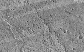 <h1>PIA06295:  Streaks and Lava Flows</h1><div class="PIA06295" lang="en" style="width:512px;text-align:left;margin:auto;background-color:#000;padding:10px;max-height:150px;overflow:auto;"><p>5 June 2004<br />This Mars Global Surveyor (MGS) Mars Orbiter Camera (MOC) picture shows alternating light and dark wind streaks superimposed over a rugged lava flow surface on the west flank of the volcano, Ascraeus Mons. A chain of pits in the upper half of the image mark the location of a collapsed lava tube. The image is located near 11.6°N, 105.5°W, and covers an area about 3 km (1.9 mi) across. The scene is illuminated by sunlight from the lower left.</p><br /><br /><a href="http://photojournal.jpl.nasa.gov/catalog/PIA06295" onclick="window.open(this.href); return false;" title="Voir l'image 	 PIA06295:  Streaks and Lava Flows	  sur le site de la NASA">Voir l'image 	 PIA06295:  Streaks and Lava Flows	  sur le site de la NASA.</a></div>