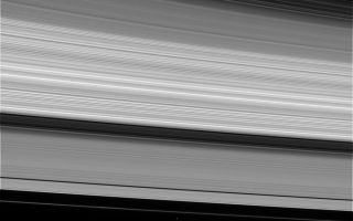 <h1>PIA06586:  Bound to Saturn</h1><div class="PIA06586" lang="en" style="width:800px;text-align:left;margin:auto;background-color:#000;padding:10px;max-height:150px;overflow:auto;"><p>Saturn's complex rings are both an intriguing scientific puzzle and a supreme natural wonder. This view shows, from upper right to lower left, the thin C ring, multi-toned B ring, the dark Cassini Division, the A ring and narrow F ring.</p><p>At the bottom, Saturn's moon Mimas (398 kilometers, or 247 miles across) orbits about 45,000 kilometers (28,000 miles) beyond the bright core of the F ring. The little moon is heavily cratered and is thought to be largely composed of water ice. The bright speck just outside of (below) the F ring is the shepherd moon Pandora (84 kilometers, or 52 miles across).</p><p>The image was taken in visible light with the Cassini spacecraft narrow angle camera on Jan. 19, 2005, at a distance of 1.8 million kilometers (1.1 million miles) from Saturn. The image scale is 11 kilometers (7 miles) per pixel. Pandora was brightened by a factor of seven to aid visibility.</p><p>The Cassini-Huygens mission is a cooperative project of NASA, the European Space Agency and the Italian Space Agency. The Jet Propulsion Laboratory, a division of the California Institute of Technology in Pasadena, manages the mission for NASA's Science Mission Directorate, Washington, D.C. The Cassini orbiter and its two onboard cameras were designed, developed and assembled at JPL. The imaging team is based at the Space Science Institute, Boulder, Colo.</p><p>For more information about the Cassini-Huygens mission, visit <a href="http://saturn.jpl.nasa.gov">http://saturn.jpl.nasa.gov</a> and the Cassini imaging team home page, <a href="http://ciclops.org">http://ciclops.org</a>.</p><br /><br /><a href="http://photojournal.jpl.nasa.gov/catalog/PIA06586" onclick="window.open(this.href); return false;" title="Voir l'image 	 PIA06586:  Bound to Saturn	  sur le site de la NASA">Voir l'image 	 PIA06586:  Bound to Saturn	  sur le site de la NASA.</a></div>