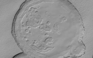 <h1>PIA06696:  South Polar Terrain</h1><div class="PIA06696" lang="en" style="width:503px;text-align:left;margin:auto;background-color:#000;padding:10px;max-height:150px;overflow:auto;"><p>19 July 2004<br />This full-resolution (1.5 meters, 5 feet, per pixel) Mars Global Surveyor (MGS) Mars Orbiter Camera (MOC) image shows mesa tops and depressions formed in layered carbon dioxide ice in the south polar residual cap. The image is located near 87.0°S, 341.9°W, and covers an area about 1.5 km (0.9 mi) wide. Sunlight illuminates the scene from the upper left.</p><br /><br /><a href="http://photojournal.jpl.nasa.gov/catalog/PIA06696" onclick="window.open(this.href); return false;" title="Voir l'image 	 PIA06696:  South Polar Terrain	  sur le site de la NASA">Voir l'image 	 PIA06696:  South Polar Terrain	  sur le site de la NASA.</a></div>