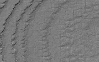 <h1>PIA06722:  South Polar Terrain</h1><div class="PIA06722" lang="en" style="width:609px;text-align:left;margin:auto;background-color:#000;padding:10px;max-height:150px;overflow:auto;"><p>25 July 2004<br />This Mars Global Surveyor (MGS) Mars Orbiter Camera (MOC) image shows layers broken-up by processes that form nearly square polygonal cracks and textures in the south polar region of Mars. Exactly how the polygons formed is anyone's guess; typically, polygon patterns in the martian polar regions are taken to indicate the presence of ground ice, similar to polygons in the Earth's arctic and antarctic regions. This picture is located near 86.4°S, 180.3°W, and is illuminated by sunlight from the upper left. The image covers an area about 3 km (1.9 mi) wide.</p><br /><br /><a href="http://photojournal.jpl.nasa.gov/catalog/PIA06722" onclick="window.open(this.href); return false;" title="Voir l'image 	 PIA06722:  South Polar Terrain	  sur le site de la NASA">Voir l'image 	 PIA06722:  South Polar Terrain	  sur le site de la NASA.</a></div>
