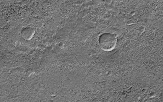 <h1>PIA06808:  Exhumed Craters near Kaiser</h1><div class="PIA06808" lang="en" style="width:672px;text-align:left;margin:auto;background-color:#000;padding:10px;max-height:150px;overflow:auto;"><p>24 August 2004<br />The upper left (northwest) corner of this Mars Global Surveyor (MGS) Mars Orbiter Camera (MOC) image shows a crater within which are several layers of eroded material. This crater, and probably all of its degraded neighbors, was once filled and buried, and was later exhumed. The burial and exhumation theme is one that repeats all over the surface of Mars, as ancient rocks are eroded to expose previously filled and buried craters, valleys, and landscapes. This particular image is located near the northwest rim of Kaiser Crater, in Noachis Terra, near 45.2°S, 342.7°W. The image covers an area about 3 km (1.9 mi) across. Sunlight illuminates the scene from the upper left.</p><br /><br /><a href="http://photojournal.jpl.nasa.gov/catalog/PIA06808" onclick="window.open(this.href); return false;" title="Voir l'image 	 PIA06808:  Exhumed Craters near Kaiser	  sur le site de la NASA">Voir l'image 	 PIA06808:  Exhumed Craters near Kaiser	  sur le site de la NASA.</a></div>