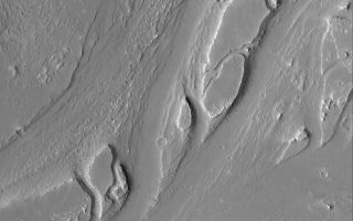 <h1>PIA06810:  West Olympica Fossae</h1><div class="PIA06810" lang="en" style="width:550px;text-align:left;margin:auto;background-color:#000;padding:10px;max-height:150px;overflow:auto;"><p>25 August 2004<br />This Mars Global Surveyor (MGS) Mars Orbiter Camera (MOC) image shows a portion of a deeply eroded valley system in the western portion of the Olympica Fossae region of central Tharsis. The valleys may have been carved by water; today they are mantled by a thick blanket of dust, and small craters formed by meteor impacts superpose the valley landforms. This picture is located near 23.0°N, 117.2°W. The image covers an area about 3 km (1.9 mi) across and sunlight illuminates the scene from the left/lower left.</p><br /><br /><a href="http://photojournal.jpl.nasa.gov/catalog/PIA06810" onclick="window.open(this.href); return false;" title="Voir l'image 	 PIA06810:  West Olympica Fossae	  sur le site de la NASA">Voir l'image 	 PIA06810:  West Olympica Fossae	  sur le site de la NASA.</a></div>
