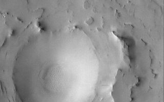 <h1>PIA06816:  Exhumed Arabian Crater</h1><div class="PIA06816" lang="en" style="width:800px;text-align:left;margin:auto;background-color:#000;padding:10px;max-height:150px;overflow:auto;"><p>26 August 2004<br />Eastern Arabia Terra shares many attributes with western Arabia and Sinus Meridiani. In particular, it is a region of vast layered rock within which are interbedded filled and buried craters and valleys. Erosion has subsequently re-exposed many of these landforms, including the exhumed and eroded crater shown in this Mars Global Surveyor (MGS) Mars Orbiter Camera (MOC) image. Following the period in which erosion occurred, the region was blanketed by dust. This image is located near 22.5°N, 318.4°W, and covers an area about 3 km (1.9 mi) across. Sunlight illuminates the scene from the left/lower left.</p><br /><br /><a href="http://photojournal.jpl.nasa.gov/catalog/PIA06816" onclick="window.open(this.href); return false;" title="Voir l'image 	 PIA06816:  Exhumed Arabian Crater	  sur le site de la NASA">Voir l'image 	 PIA06816:  Exhumed Arabian Crater	  sur le site de la NASA.</a></div>