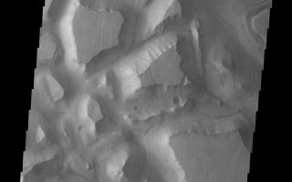 <h1>PIA06825:  Hydraotes Chaos</h1><div class="PIA06825" lang="en" style="width:797px;text-align:left;margin:auto;background-color:#000;padding:10px;max-height:150px;overflow:auto;"><a href="/figures/PIA06825_fig1.jpg"> </a><br /><p>Released August 18, 2004</br>The THEMIS Image of the Day will be exploring the <a href="/catalog/PIA06821">nomenclature of Mars</a> for the next three weeks.</p><p>Hydraotes Chaos</br>Chaos: distinctive area of broken terrain Hydraotes: Alexander the Great attacked the Mallains on the banks of the Hydraotes River (today's Ravi River) during his conquest of India.</p><p>Hydraotes Chaos is typical of chaos regions on Mars. Note the break up of the plateau into smaller mesas separated by deep valleys. In some chaos, the mesas also seem to get fractured into smaller and smaller segments.</p><p><b>Nomenclature Fact of the Day:</b> A person must be deceased for at least three years before his/her name can be used for a planetary feature.</p><p>Image information: VIS instrument. Latitude 0.4, Longitude 324.8 East (35.2 West). 19 meter/pixel resolution.</p><p>Note: this THEMIS visual image has not been radiometrically nor geometrically calibrated for this preliminary release. An empirical correction has been performed to remove instrumental effects. A linear shift has been applied in the cross-track and down-track direction to approximate spacecraft and planetary motion. Fully calibrated and geometrically projected images will be released through the Planetary Data System in accordance with Project policies at a later time.</p><p>NASA's Jet Propulsion Laboratory manages the 2001 Mars Odyssey mission for NASA's Office of Space Science, Washington, D.C. The Thermal Emission Imaging System (THEMIS) was developed by Arizona State University, Tempe, in collaboration with Raytheon Santa Barbara Remote Sensing. The THEMIS investigation is led by Dr. Philip Christensen at Arizona State University. Lockheed Martin Astronautics, Denver, is the prime contractor for the Odyssey project, and developed and built the orbiter. Mission operations are conducted jointly from Lockheed Martin and from JPL, a division of the California Institute of Technology in Pasadena.</p><br /><br /><a href="http://photojournal.jpl.nasa.gov/catalog/PIA06825" onclick="window.open(this.href); return false;" title="Voir l'image 	 PIA06825:  Hydraotes Chaos	  sur le site de la NASA">Voir l'image 	 PIA06825:  Hydraotes Chaos	  sur le site de la NASA.</a></div>