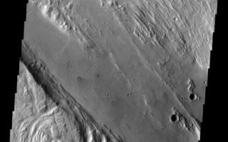 <h1>PIA06830:  Ares Vallis</h1><div class="PIA06830" lang="en" style="width:532px;text-align:left;margin:auto;background-color:#000;padding:10px;max-height:150px;overflow:auto;"><a href="/figures/PIA06830_fig1.jpg"> </a><br /><p>Released August 25, 2004</br>The THEMIS Image of the Day will be exploring the <a href="/catalog/PIA06821">nomenclature of Mars</a> for the next three weeks.</p><p>Ares Vallis</br>Vallis: valleyAres: Greek god of war, corresponding to the Roman god Mars.</p><p>Ares Vallis is one of the larger channels on Mars. It is located near several other large channels that appear to empty into Chryse Planitia. This image is a mosaic of two VIS frames.</p><p><b>Nomenclature Fact of the Day:</b> The asteroid Mathilde is one of the darkest objects in the Solar System, reflecting only about 3% of the light that strikes it. It has been described as being "blacker that coal," so its craters are named for coal fields and basins around the world.</p><p>Image information: VIS instrument. Latitude 8.6, Longitude 337.7 East (22.3 West). 19 meter/pixel resolution.</p><p>Note: this THEMIS visual image has not been radiometrically nor geometrically calibrated for this preliminary release. An empirical correction has been performed to remove instrumental effects. A linear shift has been applied in the cross-track and down-track direction to approximate spacecraft and planetary motion. Fully calibrated and geometrically projected images will be released through the Planetary Data System in accordance with Project policies at a later time.</p><p>NASA's Jet Propulsion Laboratory manages the 2001 Mars Odyssey mission for NASA's Office of Space Science, Washington, D.C. The Thermal Emission Imaging System (THEMIS) was developed by Arizona State University, Tempe, in collaboration with Raytheon Santa Barbara Remote Sensing. The THEMIS investigation is led by Dr. Philip Christensen at Arizona State University. Lockheed Martin Astronautics, Denver, is the prime contractor for the Odyssey project, and developed and built the orbiter. Mission operations are conducted jointly from Lockheed Martin and from JPL, a division of the California Institute of Technology in Pasadena.</p><br /><br /><a href="http://photojournal.jpl.nasa.gov/catalog/PIA06830" onclick="window.open(this.href); return false;" title="Voir l'image 	 PIA06830:  Ares Vallis	  sur le site de la NASA">Voir l'image 	 PIA06830:  Ares Vallis	  sur le site de la NASA.</a></div>