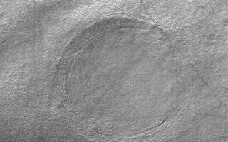<h1>PIA06895:  Buried Crater</h1><div class="PIA06895" lang="en" style="width:672px;text-align:left;margin:auto;background-color:#000;padding:10px;max-height:150px;overflow:auto;"><p>29 September 2004<br />The circular feature in this Mars Global Surveyor (MGS) Mars Orbiter Camera (MOC) image is the location of a buried impact crater in southern Noachis Terra near 55.4°S, 325.1°W. The image covers an area about 3 km (1.9 mi) across; thus the crater is roughly 2 km in diameter, or twice the size of the famous Meteor Crater in northern Arizona. A visitor to the Arizona Crater would be quite impressed by the height of its raised rims and the depth of and distance across its bowl, relative to a person. At the human scale It is challenging to imagine a crater twice that size that has been filled and buried by sediment and debris, yet the crater shown here is simply an example. On Mars, craters over 100 km in diameter have been buried, and some have been exhumed. This image is illuminated by sunlight from the upper left.</p><br /><br /><a href="http://photojournal.jpl.nasa.gov/catalog/PIA06895" onclick="window.open(this.href); return false;" title="Voir l'image 	 PIA06895:  Buried Crater	  sur le site de la NASA">Voir l'image 	 PIA06895:  Buried Crater	  sur le site de la NASA.</a></div>