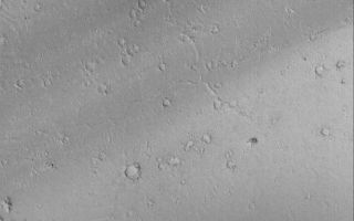 <h1>PIA06931:  Cerberus Fossae Troughs</h1><div class="PIA06931" lang="en" style="width:494px;text-align:left;margin:auto;background-color:#000;padding:10px;max-height:150px;overflow:auto;"><p>11 October 2004<br >This Mars Global Surveyor (MGS) Mars Orbiter Camera (MOC) image shows portions of two of the Cerberus Fossae troughs, their dark-toned interiors, and dark wind streaks formed from material blowing out of the troughs. The wind streaks indicate winds that blew from the northeast (upper right) toward the southwest (lower left). The crust of Mars expanded and split to form the troughs. These features are located near 6.6°N, 187.2°W. The image covers an area about 3 km (1.9 mi) wide. Sunlight illuminates the scene from the lower left.</p><br /><br /><a href="http://photojournal.jpl.nasa.gov/catalog/PIA06931" onclick="window.open(this.href); return false;" title="Voir l'image 	 PIA06931:  Cerberus Fossae Troughs	  sur le site de la NASA">Voir l'image 	 PIA06931:  Cerberus Fossae Troughs	  sur le site de la NASA.</a></div>