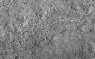 <h1>PIA06935:  The Flows of Olympus</h1><div class="PIA06935" lang="en" style="width:672px;text-align:left;margin:auto;background-color:#000;padding:10px;max-height:150px;overflow:auto;"><p>13 October 2004<br >This August 2004 Mars Global Surveyor (MGS) Mars Orbiter Camera (MOC) image shows lava flows and a collapsed lava tube on the upper southwest flank of Olympus Mons, one of the largest volcanoes ever known. The collapsed lava tube is the channel-like feature in the upper third of the image. All of the surfaces in this image are very heavily peppered by small meteor impact craters. While fairly young relative to much of the martian surface, the large volcanoes of Mars are still quite old and battered by impacts. This image is located near 17.9°N, 135.4°W, and image covers an area about 3 km (1.9 mi) wide. Sunlight illuminates the scene from the left.</p><br /><br /><a href="http://photojournal.jpl.nasa.gov/catalog/PIA06935" onclick="window.open(this.href); return false;" title="Voir l'image 	 PIA06935:  The Flows of Olympus	  sur le site de la NASA">Voir l'image 	 PIA06935:  The Flows of Olympus	  sur le site de la NASA.</a></div>