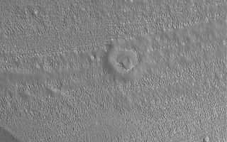 <h1>PIA06958:  Degraded Crater</h1><div class="PIA06958" lang="en" style="width:800px;text-align:left;margin:auto;background-color:#000;padding:10px;max-height:150px;overflow:auto;"><p>21 October 2004<br >Near the center of this Mars Global Surveyor (MGS) Mars Orbiter Camera (MOC) image lies the degraded remnants of an old meteor impact crater. The terrain in which it occurs is a heavily eroded, north middle-latitude surface. The image is located in the fretted terrains north of Arabia Terra near 41.3°N, 305.8°W. The image covers an area about 3 km (1.9 mi) wide and sunlight illuminates the scene from the lower left.</p><br /><br /><a href="http://photojournal.jpl.nasa.gov/catalog/PIA06958" onclick="window.open(this.href); return false;" title="Voir l'image 	 PIA06958:  Degraded Crater	  sur le site de la NASA">Voir l'image 	 PIA06958:  Degraded Crater	  sur le site de la NASA.</a></div>