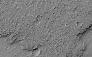 <h1>PIA07117:  Lava Flow Features</h1><div class="PIA07117" lang="en" style="width:470px;text-align:left;margin:auto;background-color:#000;padding:10px;max-height:150px;overflow:auto;"><p>2 December 2004<br >This Mars Global Surveyor (MGS) Mars Orbiter Camera (MOC) image shows details near the front edge of a lava flow in the Daedalia Planum region. Daedalia Planum is a vast region covered with the extremely large lava flows of southern Tharsis. The trough in the lower third of the image is a graben formed by extension and faulting of the martian crust. This image is located near 28.1°S, 135.0°W, and covers an area approximately 3 km (1.9 mi) across. Sunlight illuminates the scene from the upper left.</p><br /><br /><a href="http://photojournal.jpl.nasa.gov/catalog/PIA07117" onclick="window.open(this.href); return false;" title="Voir l'image 	 PIA07117:  Lava Flow Features	  sur le site de la NASA">Voir l'image 	 PIA07117:  Lava Flow Features	  sur le site de la NASA.</a></div>