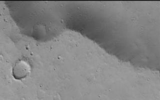 <h1>PIA07126:  Ceraunius Tholus Feature</h1><div class="PIA07126" lang="en" style="width:332px;text-align:left;margin:auto;background-color:#000;padding:10px;max-height:150px;overflow:auto;"><p>11 December 2004<br >Today's Mars Picture of the Day features two images. The top picture is a mosaic of Viking orbiter images acquired in the late 1970s. The lower image is a high resolution picture from the Mars Global Surveyor (MGS) Mars Orbiter Camera (MOC). The Viking mosaic shows Ceraunius Tholus, a volcano in the Tharsis region that was first viewed in images obtained by Mariner 9 in 1972. Several channels run down the slope of the Ceraunius Tholus volcano. The deepest of those channels ends in an elliptical crater. The elliptical crater was formed by a very oblique meteor impact. Where the channel meets the floor of the elliptical crater, there is a small mound of material. Presumably, this material was deposited in the elliptical crater after running down through the channel on the volcano's northwest flank. </p><p>Near the top/center of the mound in the elliptical crater is a small, circular depression. Some have speculated for years that this depression is related to volcanism, others thought that it may be an impact crater. The MGS MOC image (lower of the two images) shows that crater. It is not the source of lava flows or any other volcanic features. Most likely, it is an old impact crater. This feature is located near 25.2°N, 97.7°W. The MOC image covers an area approximately 3 km (1.9 mi) wide and is illuminated by sunlight from the lower left. </p><br /><br /><a href="http://photojournal.jpl.nasa.gov/catalog/PIA07126" onclick="window.open(this.href); return false;" title="Voir l'image 	 PIA07126:  Ceraunius Tholus Feature	  sur le site de la NASA">Voir l'image 	 PIA07126:  Ceraunius Tholus Feature	  sur le site de la NASA.</a></div>