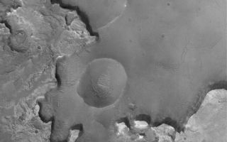 <h1>PIA07127:  Exhuming Craters in a Crater</h1><div class="PIA07127" lang="en" style="width:749px;text-align:left;margin:auto;background-color:#000;padding:10px;max-height:150px;overflow:auto;"><p>12 December 2004<br >Burial and exhumation of impact craters, and their destruction by erosion, are common and repeated themes all over the surface of Mars. Many craters in western Arabia Terra exhibit light-toned, layered outcrops of ancient sedimentary rock. Like the sedimentary rocks explored further to the south in Meridiani Planum by the Opportunity Mars Exploration Rover (MER-B), these intracrater sedimentary rocks may have been deposited in water. This Mars Global Surveyor (MGS) Mars Orbiter Camera (MOC) image shows an example of light-toned sedimentary rocks outcropping in a crater that is much farther north than most of the similar examples in western Arabia. This one is located near 36.6°N, 1.4°W, and shows several old impact craters in various states of erosion and exhumation from beneath and within the sedimentary rock materials. The image covers an area approximately 3 km (1.9 mi) wide and is illuminated by sunlight from the lower left.</p><br /><br /><a href="http://photojournal.jpl.nasa.gov/catalog/PIA07127" onclick="window.open(this.href); return false;" title="Voir l'image 	 PIA07127:  Exhuming Craters in a Crater	  sur le site de la NASA">Voir l'image 	 PIA07127:  Exhuming Craters in a Crater	  sur le site de la NASA.</a></div>