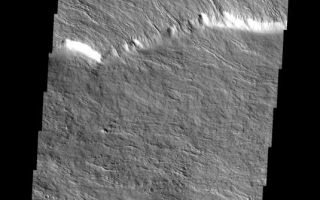<h1>PIA07199:  Olympus Mons In Visible Light</h1><div class="PIA07199" lang="en" style="width:535px;text-align:left;margin:auto;background-color:#000;padding:10px;max-height:150px;overflow:auto;"><p><a href="/figures/PIA07199_fig1.jpg"> </a><br /><p>This is a VIS image of the same location on the flank of Olympus Mons as the IR images of the past two days. At the higher resolution of the visible imager it is easy to see individual lava flows. Note that many flows have a central channel with raised edges and are fairly narrow, this is due to the slope of the volcano that the flow is running down.</p><p>Image information: VIS instrument. Latitude 17.1, Longitude 230.2 East (129.8 West). 19 meter/pixel resolution.</p><p>Note: this THEMIS visual image has not been radiometrically nor geometrically calibrated for this preliminary release. An empirical correction has been performed to remove instrumental effects. A linear shift has been applied in the cross-track and down-track direction to approximate spacecraft and planetary motion. Fully calibrated and geometrically projected images will be released through the Planetary Data System in accordance with Project policies at a later time.</p><p>NASA's Jet Propulsion Laboratory manages the 2001 Mars Odyssey mission for NASA's Office of Space Science, Washington, D.C. The Thermal Emission Imaging System (THEMIS) was developed by Arizona State University, Tempe, in collaboration with Raytheon Santa Barbara Remote Sensing. The THEMIS investigation is led by Dr. Philip Christensen at Arizona State University. Lockheed Martin Astronautics, Denver, is the prime contractor for the Odyssey project, and developed and built the orbiter. Mission operations are conducted jointly from Lockheed Martin and from JPL, a division of the California Institute of Technology in Pasadena.</p><br /><br /><a href="http://photojournal.jpl.nasa.gov/catalog/PIA07199" onclick="window.open(this.href); return false;" title="Voir l'image 	 PIA07199:  Olympus Mons In Visible Light	  sur le site de la NASA">Voir l'image 	 PIA07199:  Olympus Mons In Visible Light	  sur le site de la NASA.</a></div>